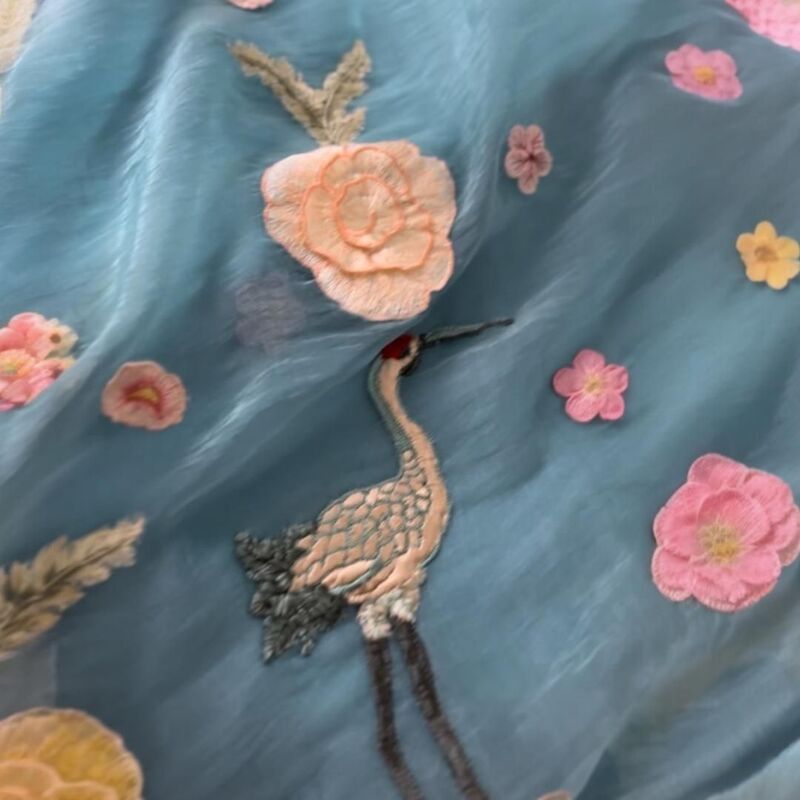 Ethereal Sky Blue Crushed Organza Saree with 3D Floral & Crane Appliqué