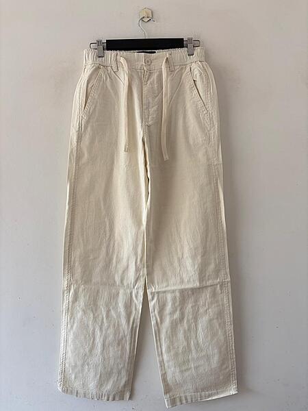 Off‑white baggy-fit linen pants