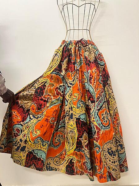 Aira's flared & panelled skirt - orange & paisleys