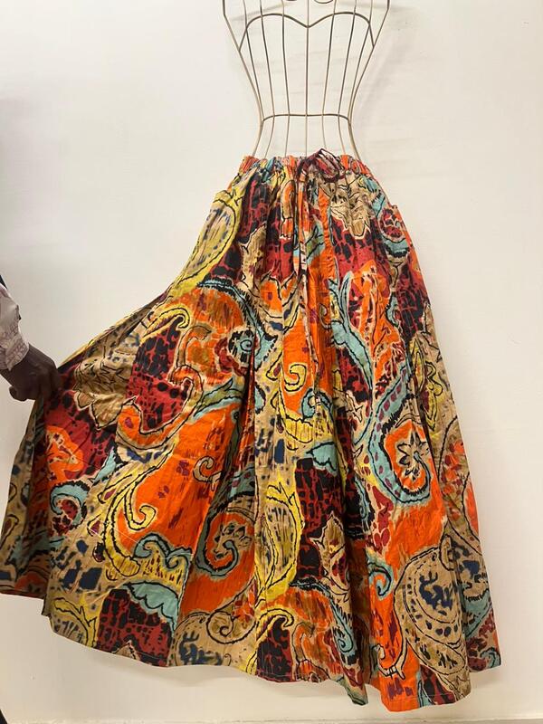 Aira's flared & panelled skirt - orange & paisleys