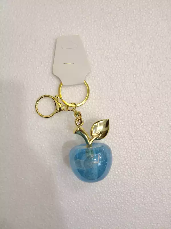 A Charming Blue Glitter Apple Keychain