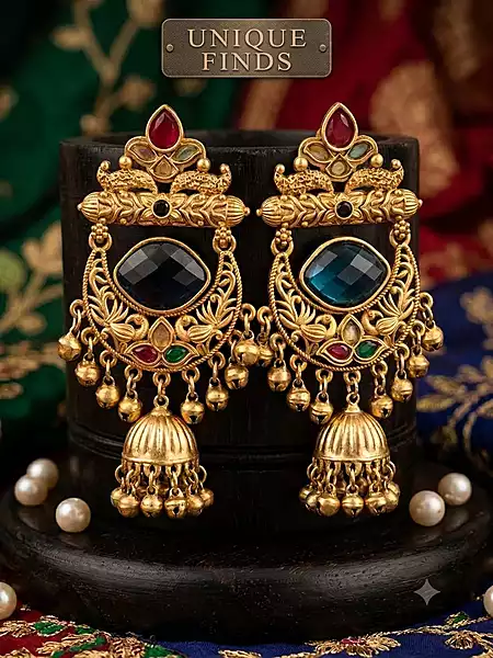 Antique gold-plated jhumka earrings.