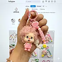 A pink Curly-Hair Cartoon Doll Bag Charm / keychain