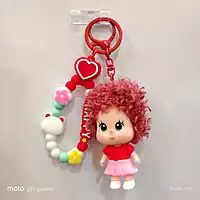 A Red & Pink Curly-Haired Cartoon Doll Bag Charm / keychain