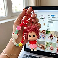 A Red & Pink Curly-Haired Cartoon Doll Bag Charm / keychain