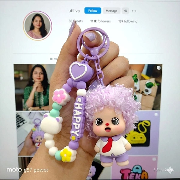 A Purple Curly-Haired Cartoon Doll Bag Charm / keychain