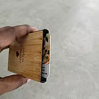 Bamboo visiting card holder designed with a sliding knob mechanism to dispense cards