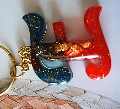 'E' PASSION KEYCHAIN9LKI00013) 'E' PASSION KEYCHAIN9LKI00013)