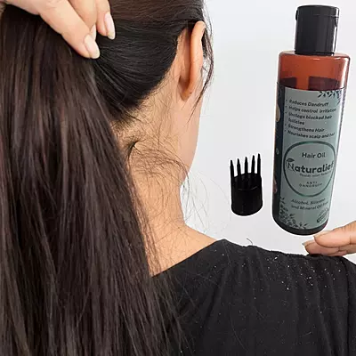 Herbal Anti-Dandruff Hair Oil – The Natural Way to Flake-Free, Healthy Hair