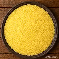 Raw Bodhana Noorjahan rice grains in rustic bowl on wooden surface.