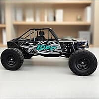 LDRC Model 18499B performing indoor obstacle rock climbing with extreme axle articulation