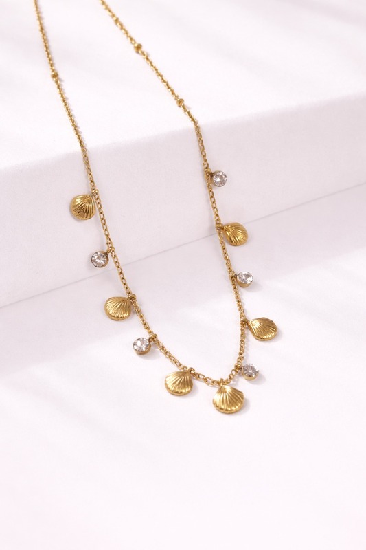 Delicate gold seashell necklace with zirconia