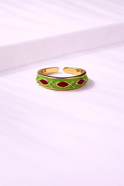Gold ring with green enamel and red stones