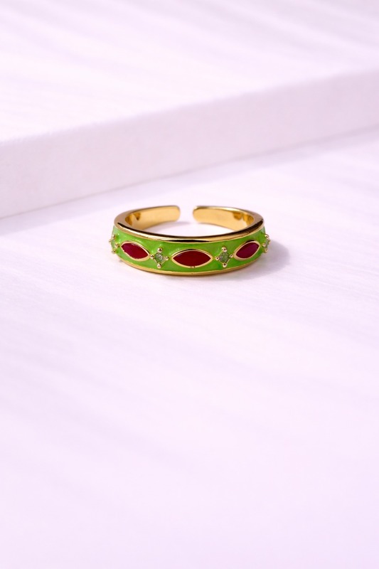 Gold ring with green enamel and red stones