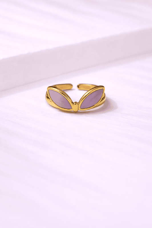 Gold ring with lilac stones