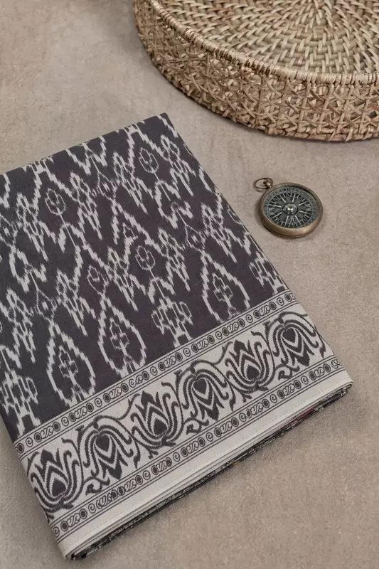Black and white pure cotton saree with Ikat-inspired pattern and simple border