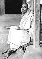 Holy Mother Sri Sarada Devi - Seated on Veranda at Jayrambati - Side View