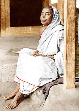 Holy Mother Sri Sarada Devi - Seated on Veranda at Jayrambati - Side View
