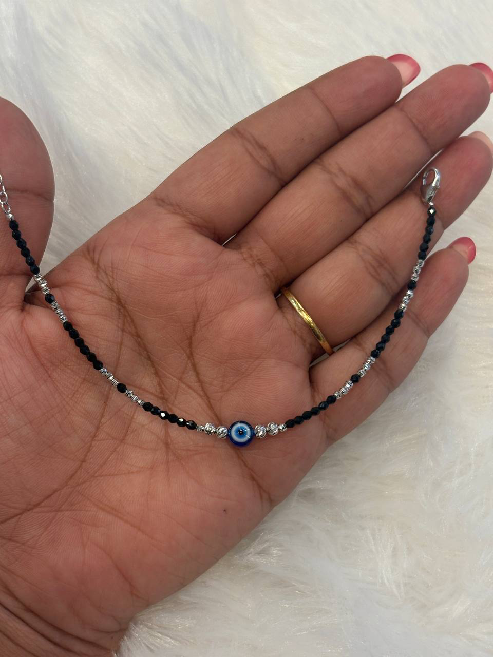 Silver evil eye bracelet with adjutable rings