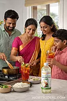 Kerala family preparing summer drink using traditional coconut oil