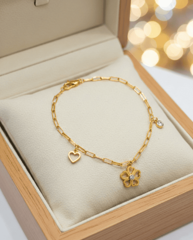 18 kt Gold Floral & Heart Charm Bracelet