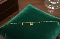18 kt Gold Floral & Heart Charm Bracelet