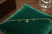 18 kt Gold Floral & Heart Charm Bracelet