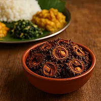 Sundried pavakka served with Kerala meals on wooden table | Worth2Deal