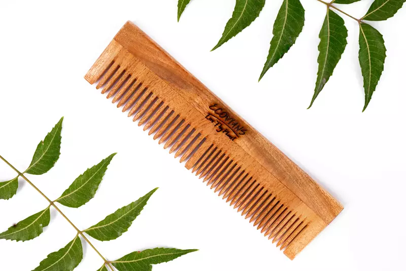 Handmade neem wood comb with wide and fine teeth Handmade neem wood comb with wide and fine teeth