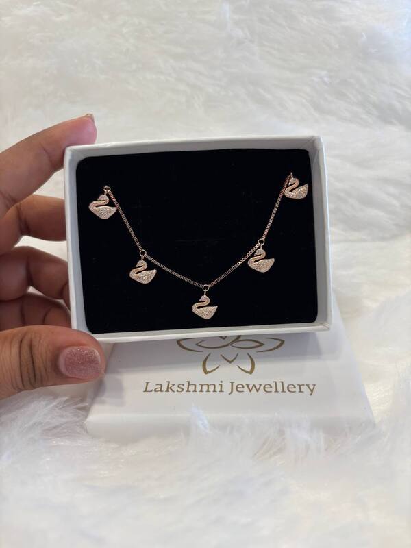 Silver swan charms bracelet with rosegold finish