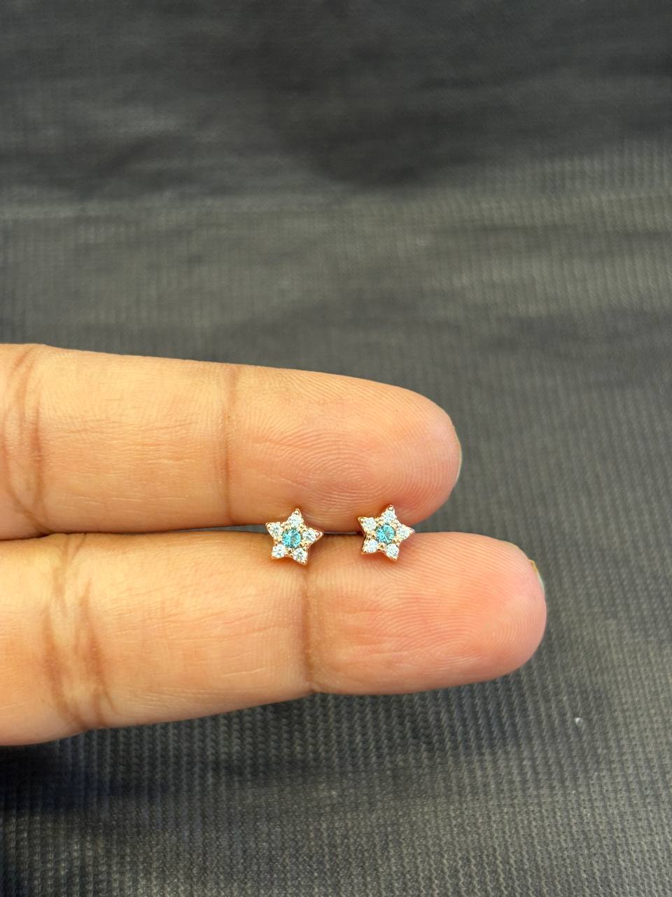 Silver star with blue stone second stud with rosegold finish