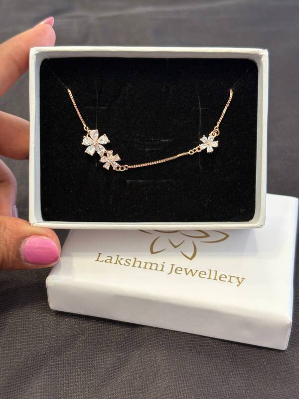 Silver triple flower bracelet with rosedgolds finish