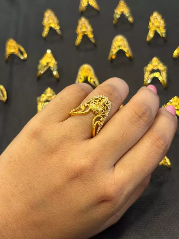 Silver vangi ring with lakshmi white stone with gold finish