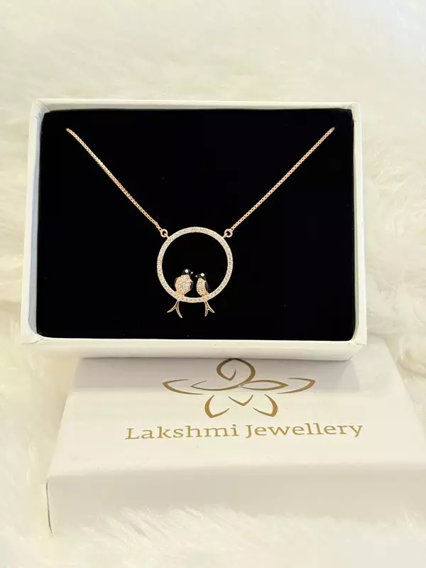 Silver twin kuyil pendant with rosegold finish