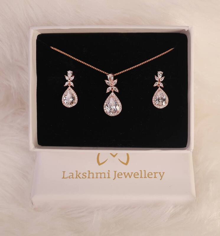 Silver vizhi pendant set with rosegold finish