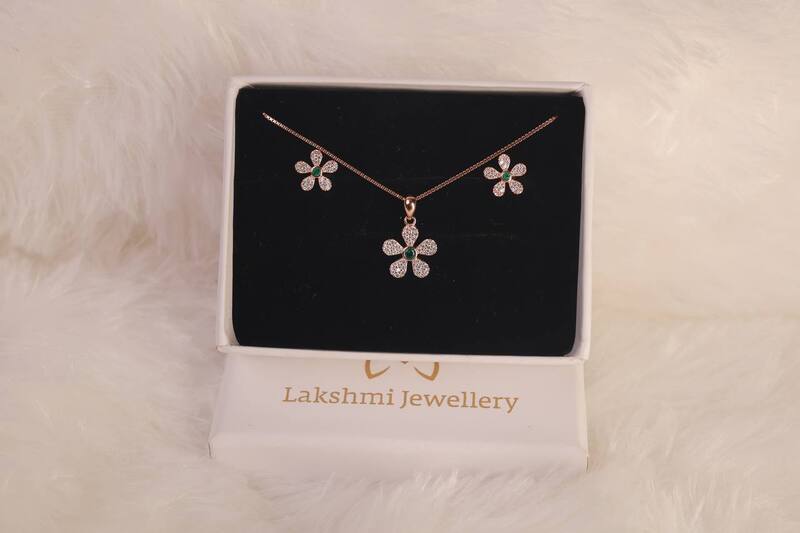 Silver flower green center stone with rosegold finish