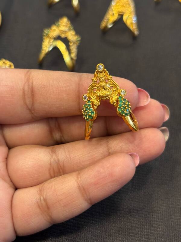 Silver vangi ring with peacock and lakshmi with gold finish