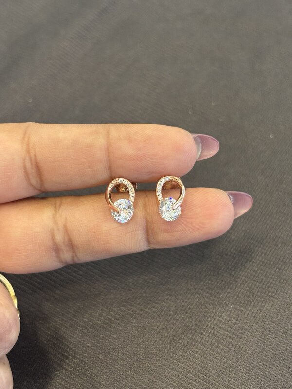 Silver rolling solitaire stud with rosegold finish