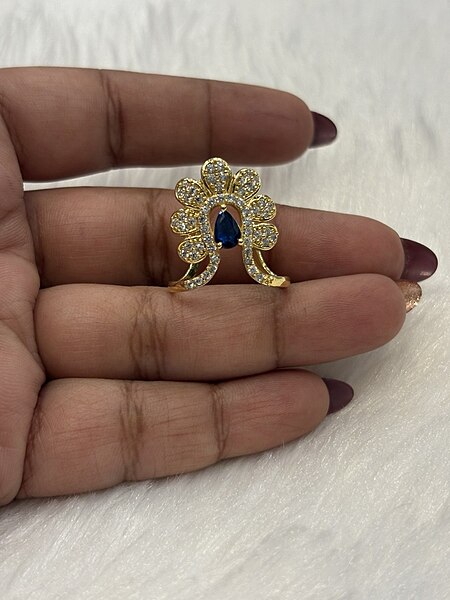 Silver blue vizhi vangi ring with gold finish