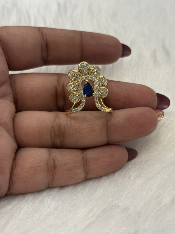Silver blue vizhi vangi ring with gold finish
