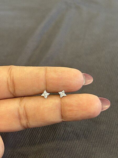 Silver four stone second stud