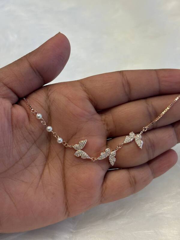 Silver tri butterfly bracelet with rosegold finish