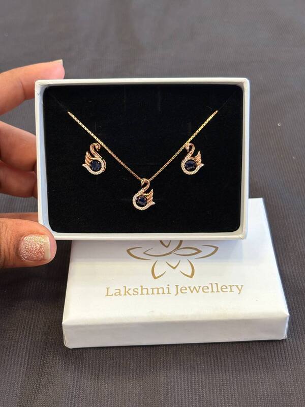 Silver blue swan pendant set with rosegold finish