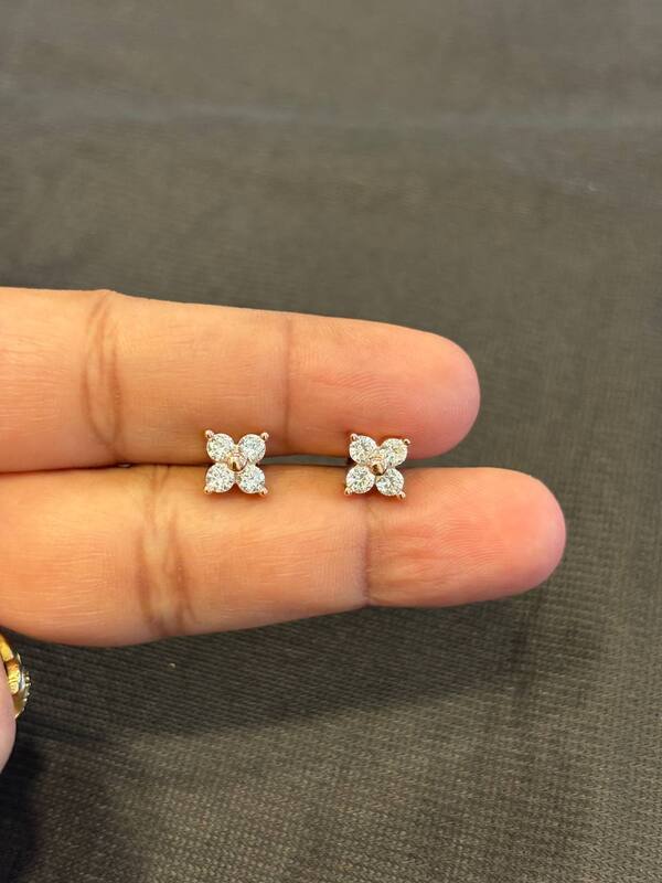 Silver four stone stud with rosegold finish