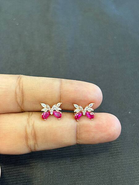 Silver fluy stud with rosegold finish