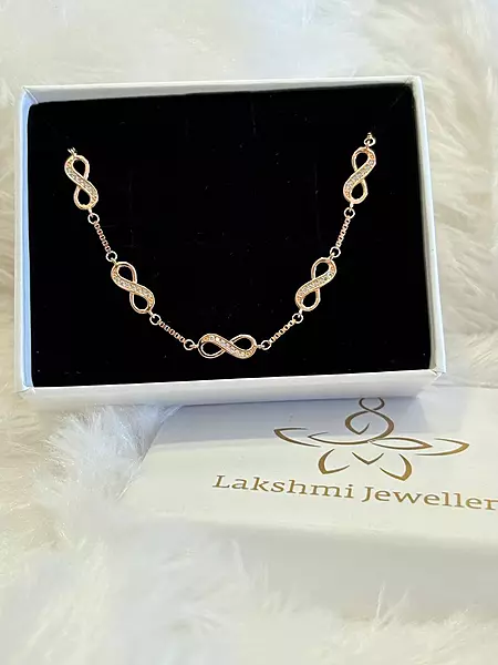 Silver multi infinity bracelet with rosegold finish
