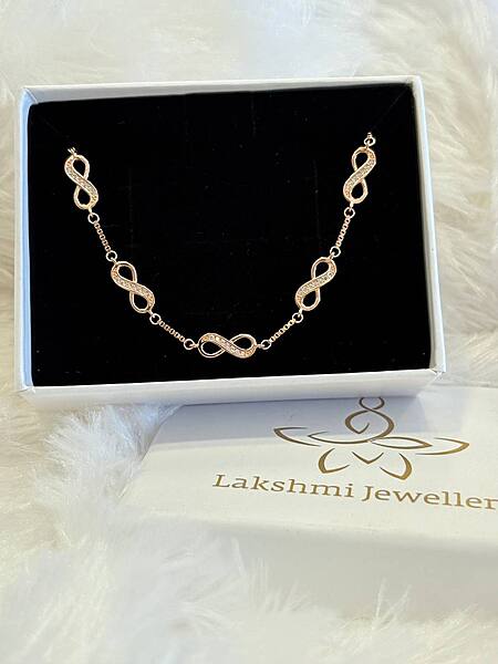 Silver multi infinity bracelet with rosegold finish