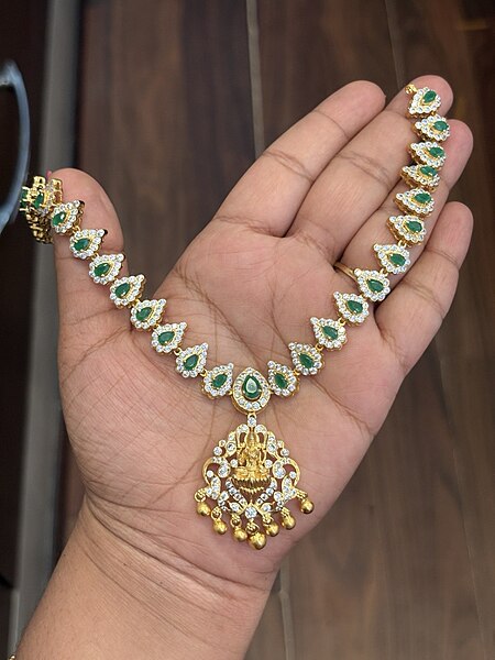 Silver green stone lakshmi with gold finish