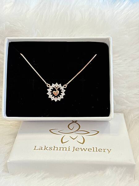 Silver karthigai stud with rosegold finish