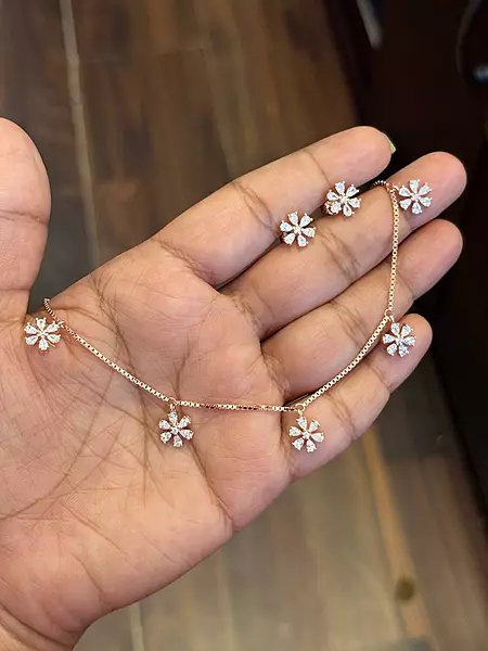 Silver flowery white charm with rosegold finish